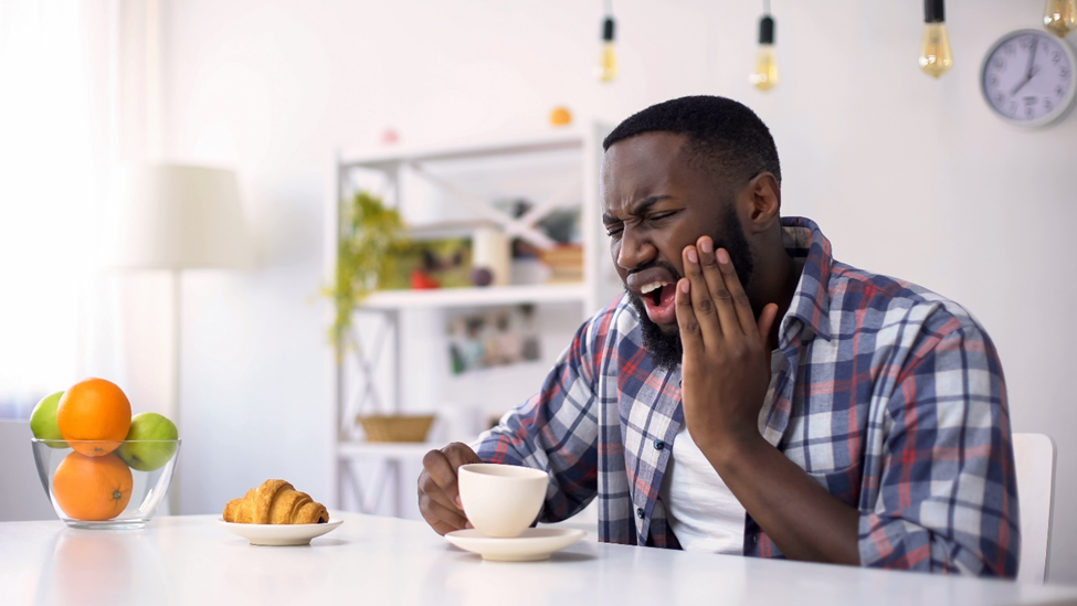 man has teeth sensitivity over brushing